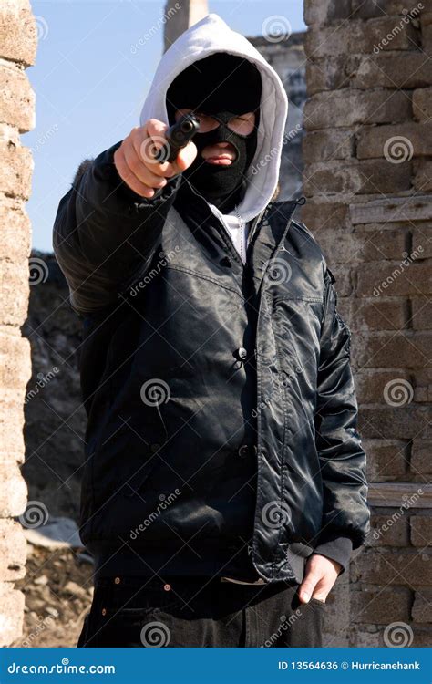 Criminal Pointing With A Gun Royalty Free Stock Image - Image: 13564636