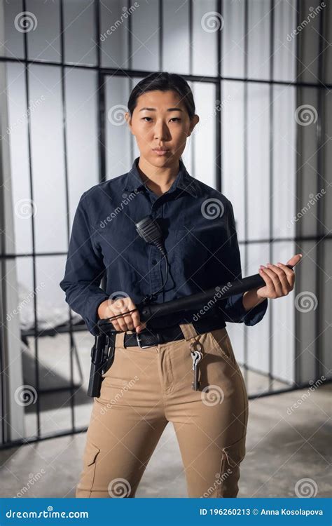 Cute Young Asian Woman Works As a Prison Guard, Posing in Uniform Stock ...