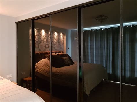 Built in wardrobe ideas, smoked glass sliding mirror doors | Dressing room design, Sliding ...