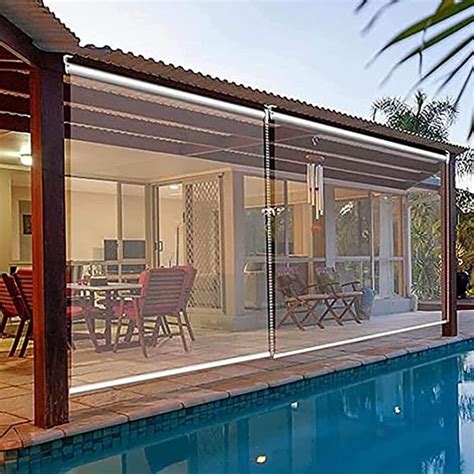 a house that has a pool in front of it and some chairs on the side