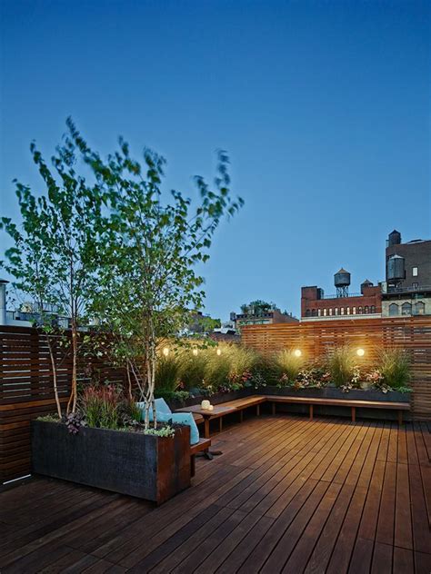 An urban rooftop garden casts a warm twilight glow – Artofit