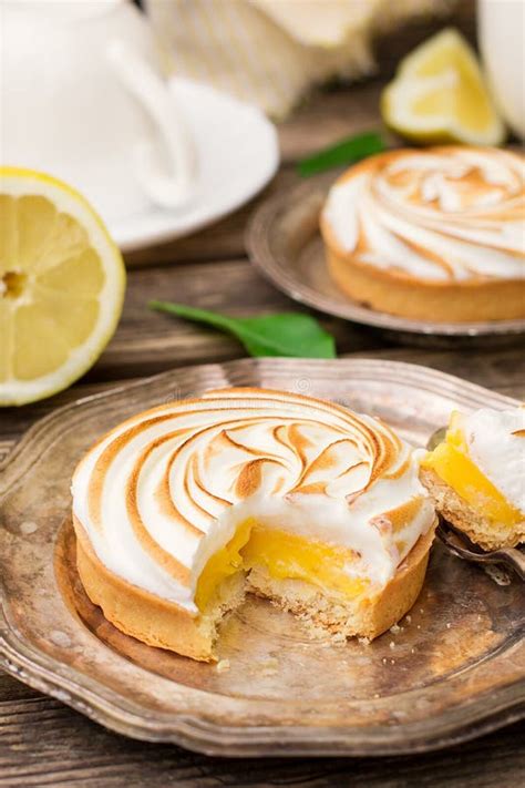 Mini lemon meringue pies stock image. Image of lemon - 100580755