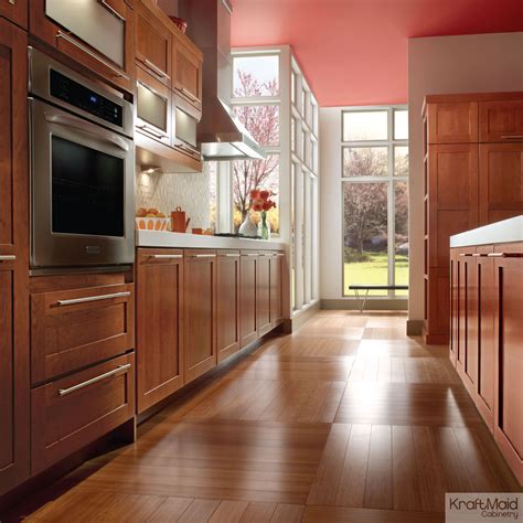 Cherry cabinetry in KraftMaid’s Cinnamon stain adds warmth to this contempo… | Kitchen and bath ...