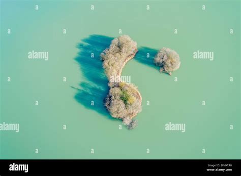 aerial view of a small island in a green water lagoon Stock Photo - Alamy