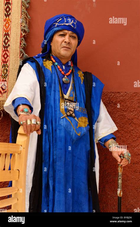 Traditional blue clothing costume of Berber Taureg man standing against ...