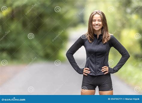 Fit Female Sportswoman Doing Curtsy Lunge Exercise With Dumbbells In Group Fitness Studio Class ...