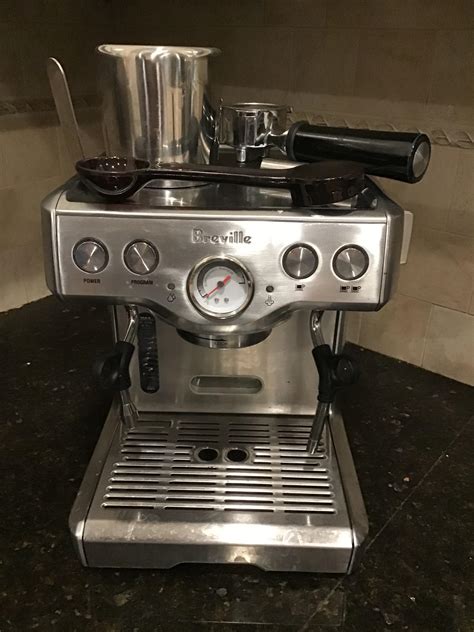 I found a Breville espresso machine, appears new in original packaging with all accessories for ...