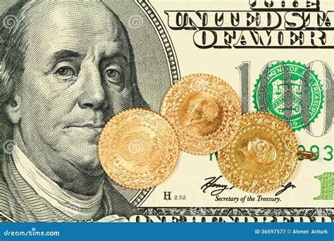 Gold coins on 100 Dollar stock image. Image of economic - 36597577