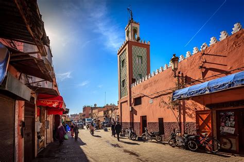 Street life in Marrakesh Medina with pedestrian and motorcycles passing by | Ferry building san ...