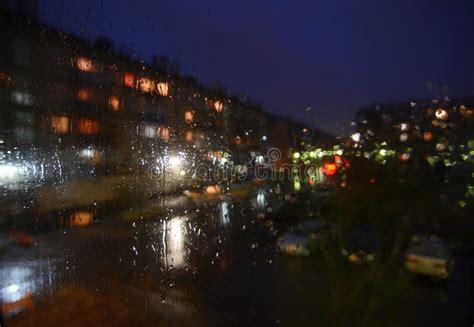 Night Rainy Sityscape Outside the Window Pane - Defocused Blurred ...