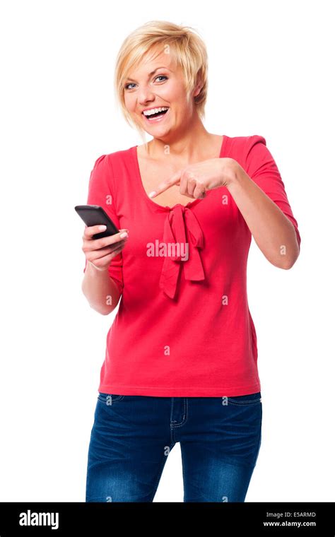 Laughing woman pointing on mobile phone Debica, Poland Stock Photo - Alamy