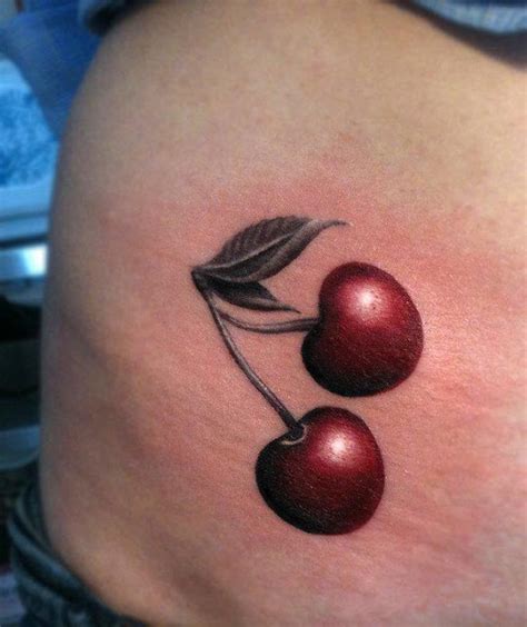 Red realistic cherry tattoo