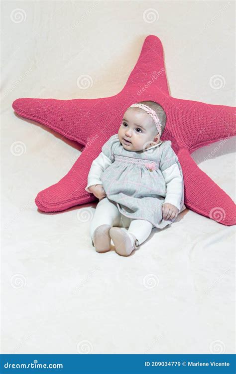 Baby girl on a star stock image. Image of person, generation - 209034779