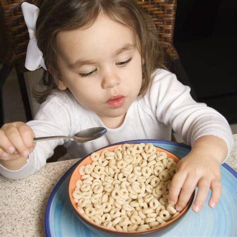 Girl eating cereal. stock image. Image of female, child - 2284489