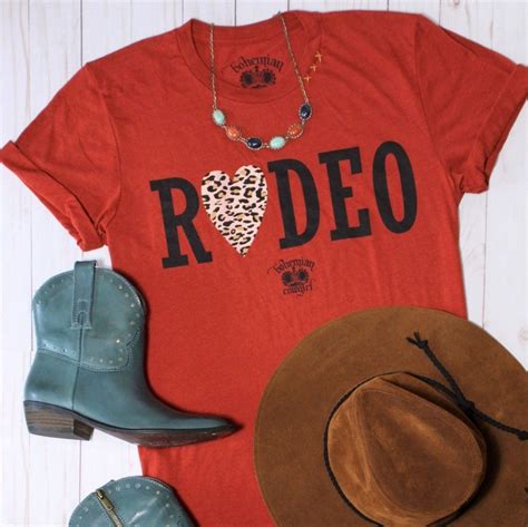 Get ready to rodeo with our Rodeo Leopard Heart T-Shirt in Brick Red! Printed on soft ...