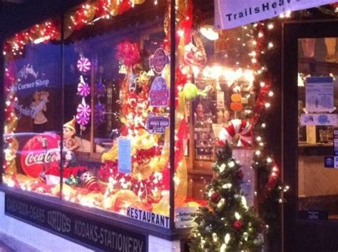 a store front decorated with christmas lights and decorations