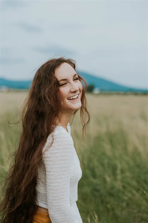 Woman Smiling White Standing On Green Grass Field During Daytime Image ...