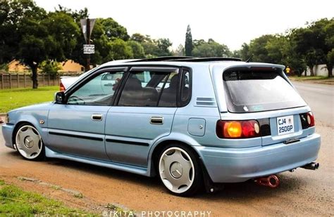 Blue Toyota Corolla Parked on the Side of the Road