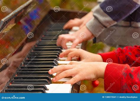 Playing the Four Hands Piano, Side View Stock Image - Image of ...