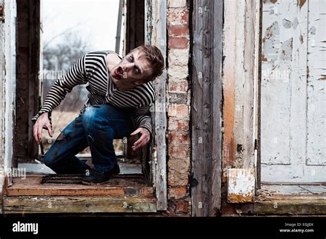 Evil looking possessed man in destroyed building Stock Photo - Alamy