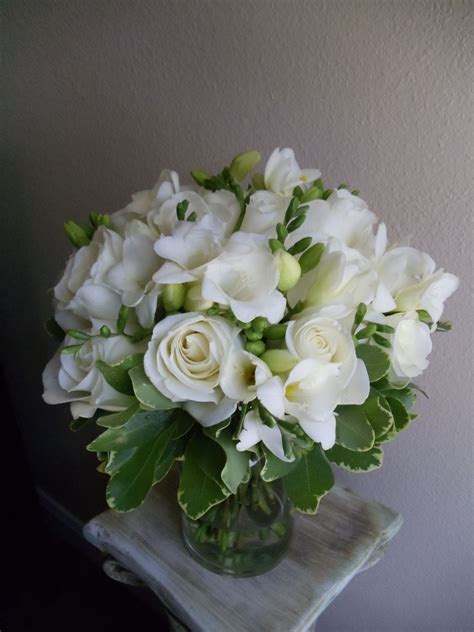 White roses, freesia and variegated pitt greenery. Freesia Bouquet, Wedding Bouquets, Wedding ...