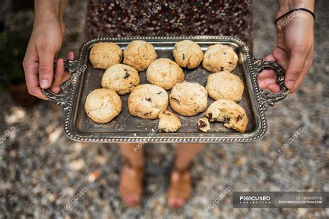 Hands holding homemade cookies — crop, outdoors - Stock Photo | #164048998