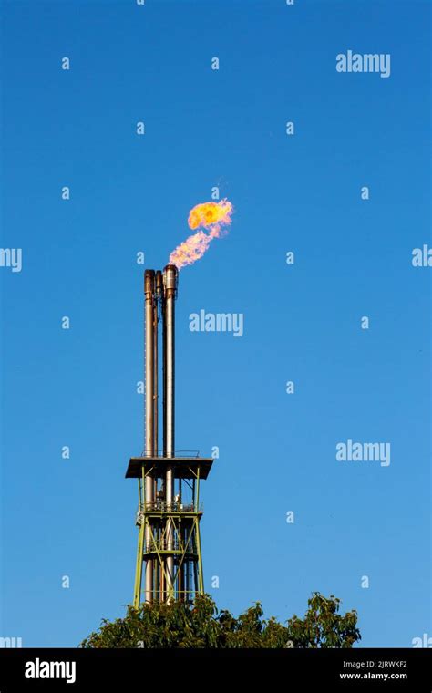 Burning Gas Flare In Oil Refinery Stock Photo - Alamy