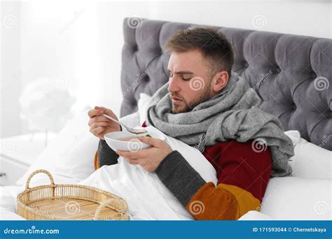 Sick Young Man with Bowl of Tasty Soup in Bed Stock Photo - Image of cure, food: 171593044