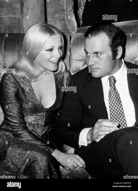 Actress Virna Lisi seated with her husband Franco Pesci Stock Photo ...