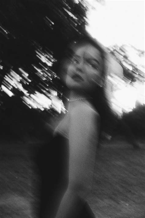 Blurry Black and White Picture of a Young Woman Standing Outside · Free ...