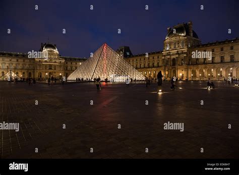 Louvre pyramid palace night Stock Photo - Alamy