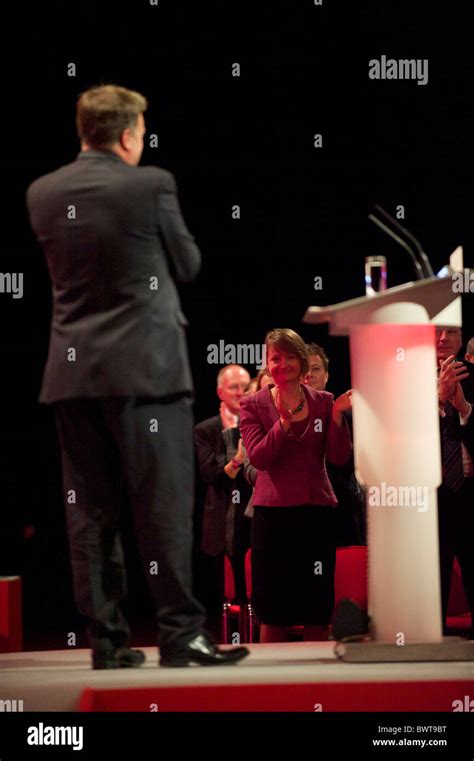 Yvette Cooper, looks on as husband Ed Balls addresses delgates ...