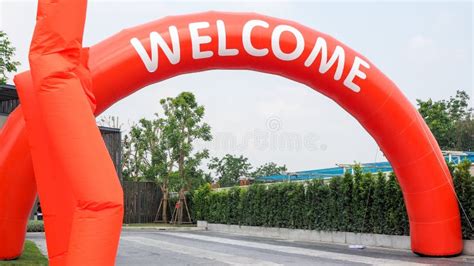 Orange Curve Balloon with White Text WELCOME and Fan Blowing Balloons ...