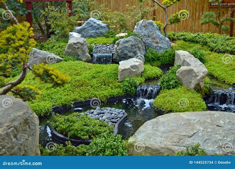 Zen garden with waterfall stock photo. Image of green - 144525734