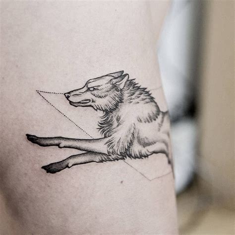 Dot-work style running wolf tattoo on the thigh | Wolf tattoos for women, Small wolf tattoo ...