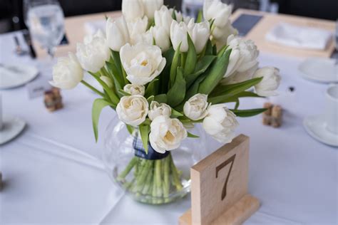 White Tulip Centerpieces and Wooden Table Numbers