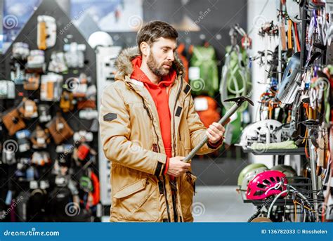 Man Choosing Choosing Mountaineer Equipment in the Shop Stock Image ...