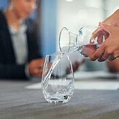 Business staff, hands and pouring water into glass of a employee ready ...