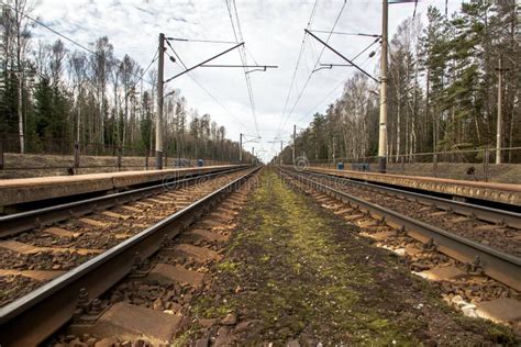 Parallel Railway Tracks With Railway Station Stock Photo - Image of railroad, forward: 78693050