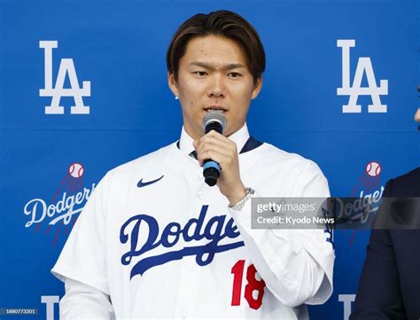 Newly signed Los Angeles Dodgers pitcher Yoshinobu Yamamoto speaks as ...