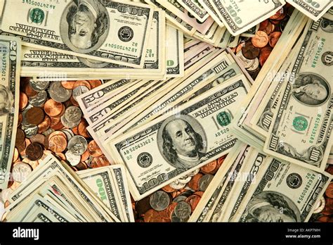 Pile of American money bills and coins Stock Photo - Alamy