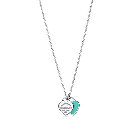 Return to Tiffany™ mini double heart tag pendant in silver with Tiffany Blue enamel finish on a ...