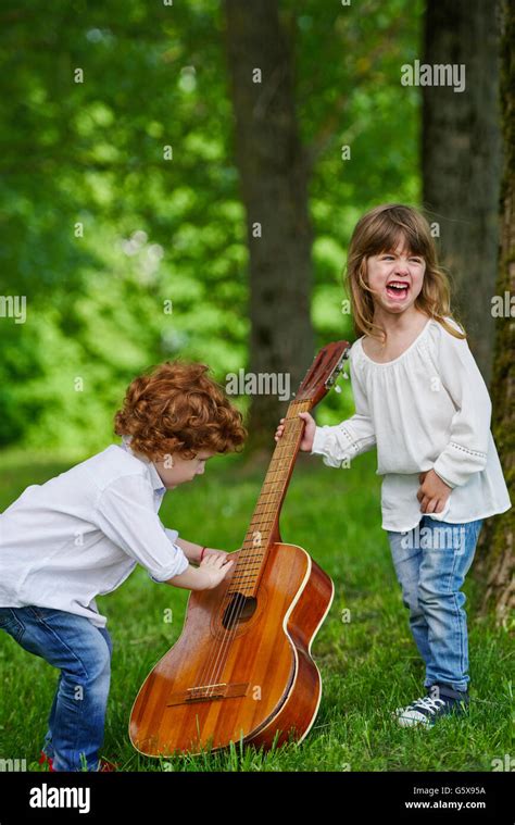 cute children playing guitar Stock Photo - Alamy