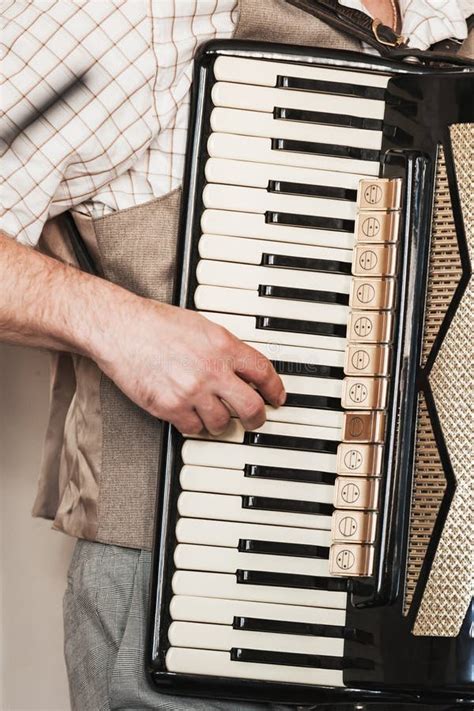 Accordionist Plays Accordion, Vertical Stock Image - Image of melody, instruments: 153460247