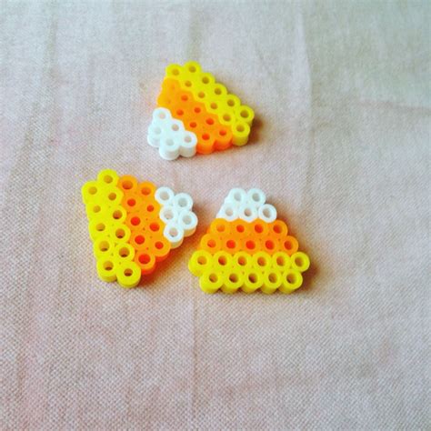 Candy corn perlerbead | Easy perler beads ideas, Iron beads, Pearl ...