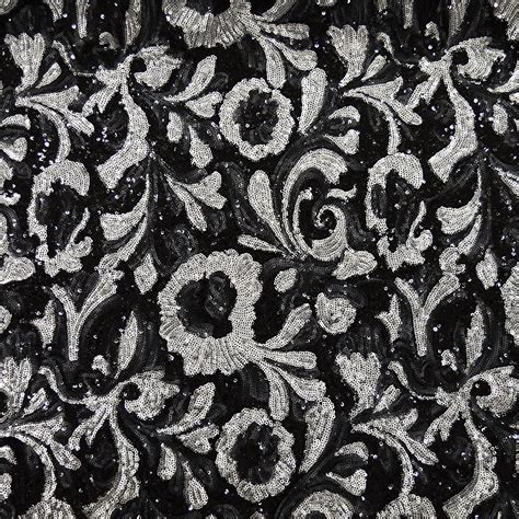 Silver sequins fabric on black background — Tissus en Ligne