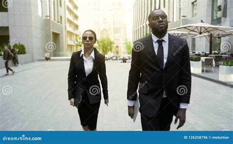 Serious Police Detectives Walking in City Downtown, Investigators on ...