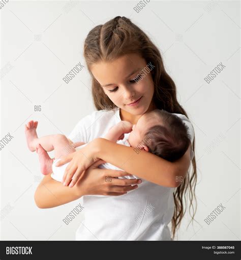 Little Girl Holding Image & Photo (Free Trial) | Bigstock