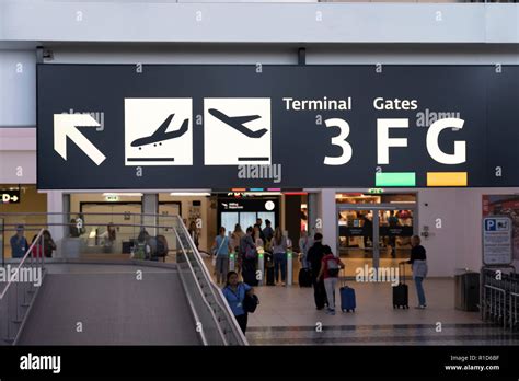 An illuminated sign at Vienna International Airport showing directions ...