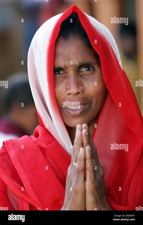 Indian woman giving the Namaste greeting from India. Rampur Region, Uttar Pradesh, India, Asia ...